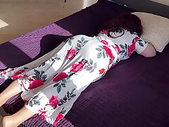 The stepmom lay down on the bed but the stepson disturbed her