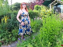 Big-chested honey Red XXX frigs herself in the garden