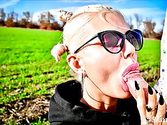 Adorable cutie sucks my dick in the middle of a field and gets cum in her mouth