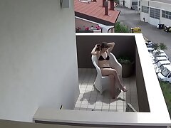 Snooping my nubile neighbour tugging on her balcony