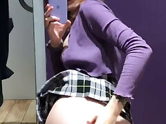Youthfull girl switching clothes in the locker apartment after college