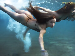 Nasty sweet babe in the pool and lezzies in sea on Tenerife