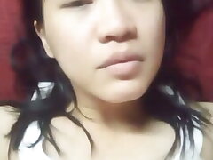 Chinese damsel alone solo bored to be at home alone frolicking with fruit