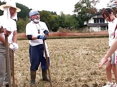 Young Asian is shown how to bang