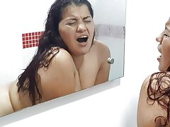 My stepmom enters while I'm taking a douche and we end up fucking.
