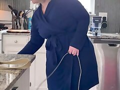 Spy on mom cleaning nude in the kitchen