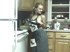 Sex-positive girl screws her cunny with kitchen utensils on counter